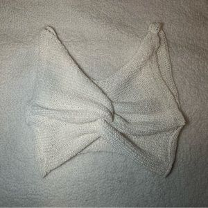 white knitted beach top with middle twist knot